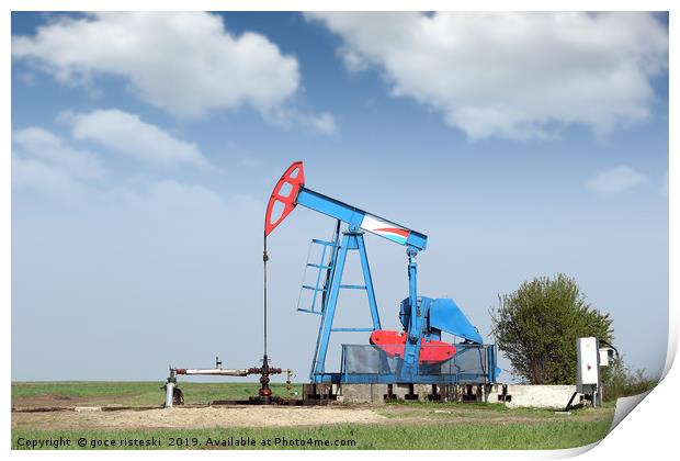 oil pump jack on field Print by goce risteski