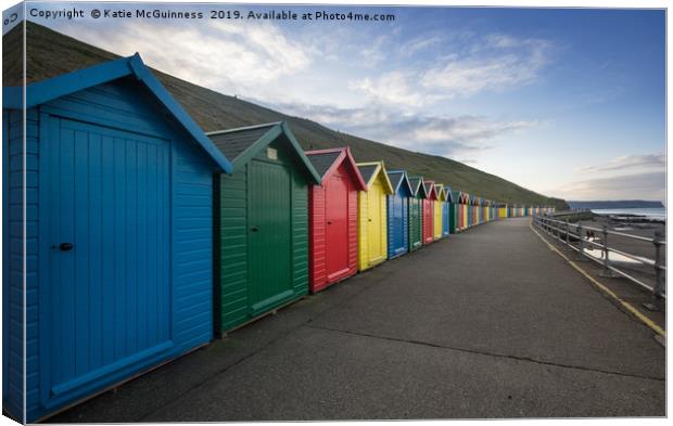 Colourful Beach Huts at Whitby Canvas Print by Katie McGuinness
