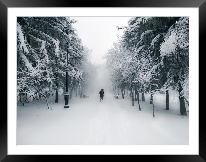 Snow-covered city alley with a lonely passer Framed Mounted Print by Dobrydnev Sergei