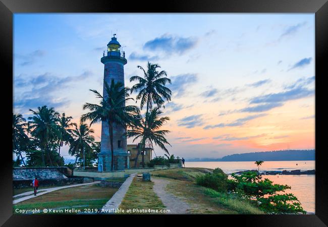 Galle fort lighthouse at sunrise Framed Print by Kevin Hellon
