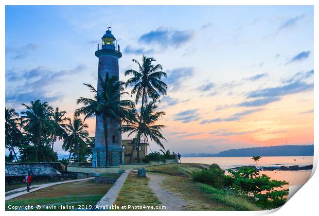 Galle fort lighthouse at sunrise Print by Kevin Hellon