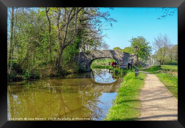 A Walk along the Canal Framed Print by Jane Metters