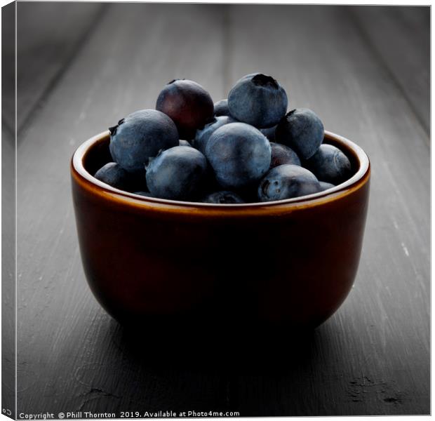 Still life of blueberries in a bowl Canvas Print by Phill Thornton
