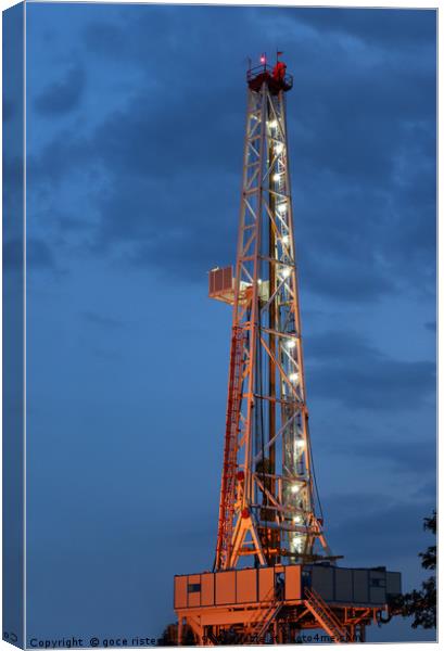 illuminated land oil drilling rig Canvas Print by goce risteski