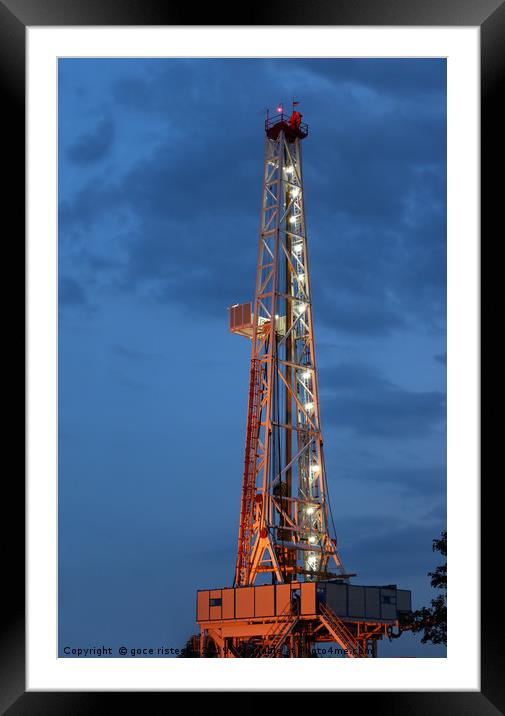 illuminated land oil drilling rig Framed Mounted Print by goce risteski