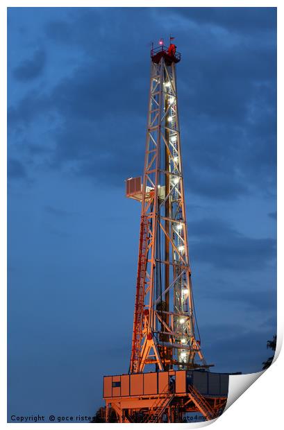 illuminated land oil drilling rig Print by goce risteski