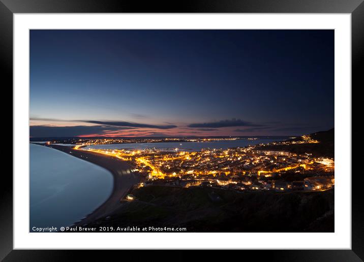 Portland at night looking towards Weymouth Framed Mounted Print by Paul Brewer