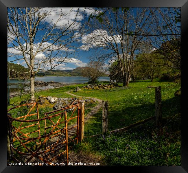 Through a kissing gate to a holiday home by a Loch Framed Print by Richard Smith