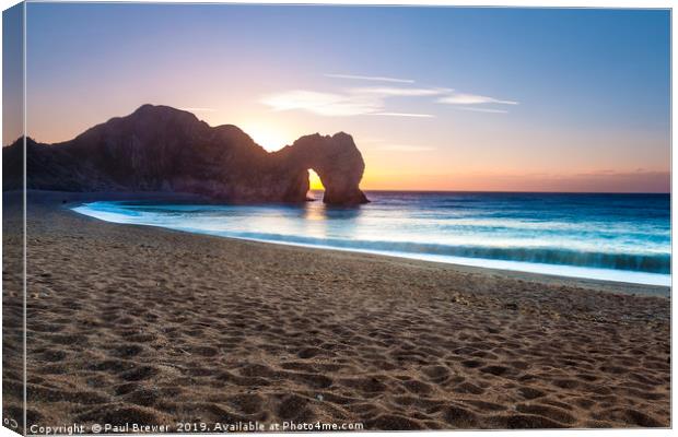 Durdle Door at sunrise Canvas Print by Paul Brewer