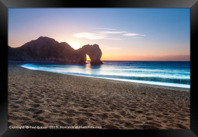 Durdle Door at sunrise Framed Print by Paul Brewer