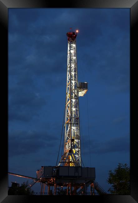 land oil drilling rig illuminated Framed Print by goce risteski