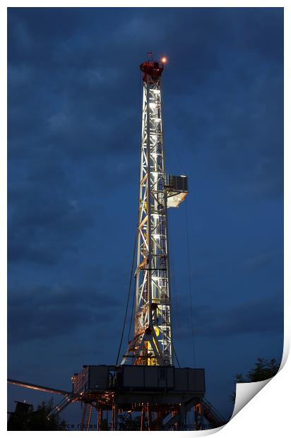 land oil drilling rig illuminated Print by goce risteski