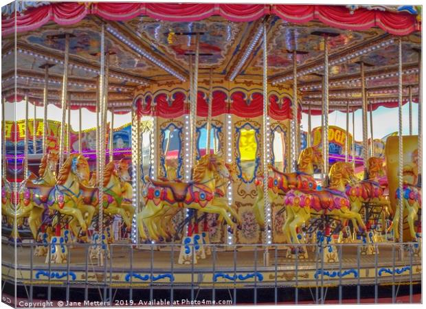 The Colourful Carousel  Canvas Print by Jane Metters