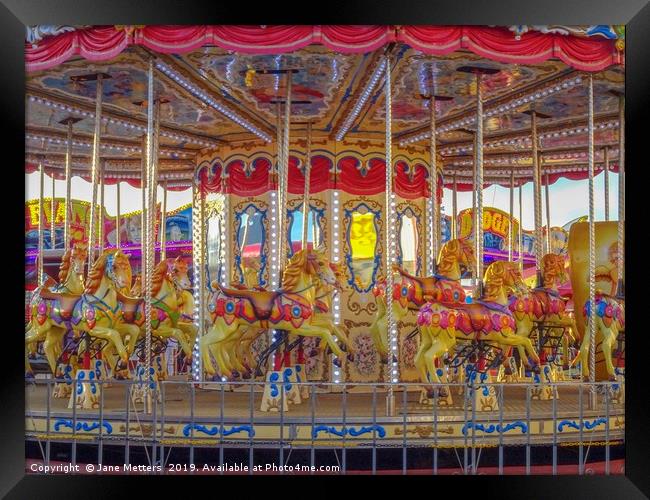 The Colourful Carousel  Framed Print by Jane Metters