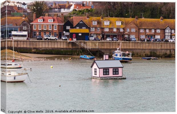 Floating house in Folkestone Harbour in Kent Canvas Print by Clive Wells