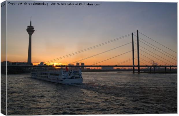 Vessel Moving Along The Rhine Embankment  At Sunse Canvas Print by rawshutterbug 