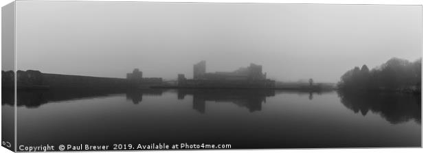 Caerphilly Castle on a misty gloomy day Canvas Print by Paul Brewer