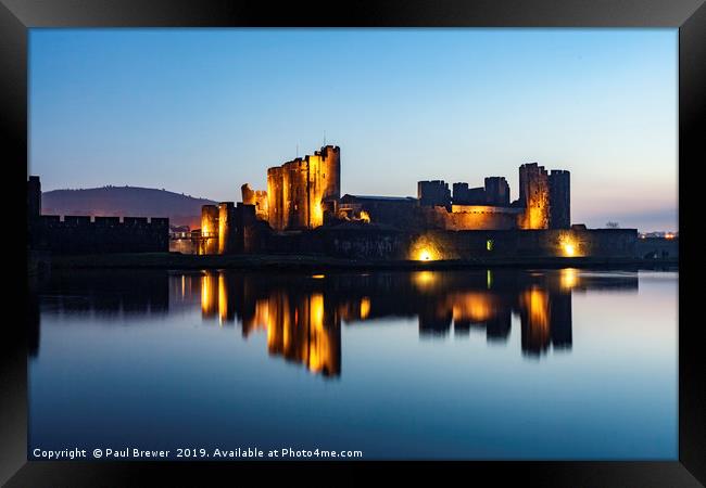 Caerphilly Castle at night in winter Framed Print by Paul Brewer