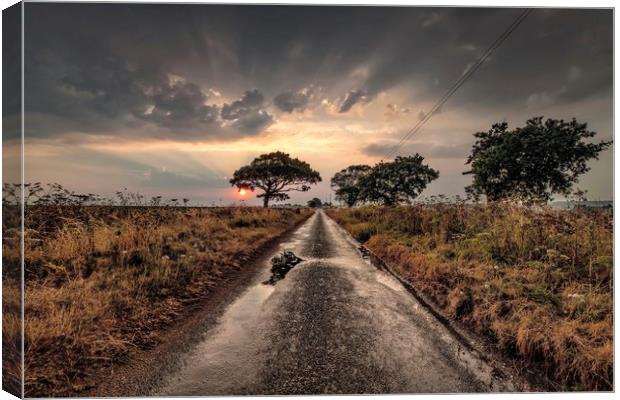 Sunrise and showers on the road to Thornham Canvas Print by Gary Pearson