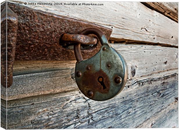 Old Lock On A Wooden Door Canvas Print by Jukka Heinovirta