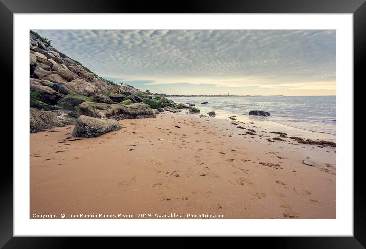 Small wet sand beach surrounded by steep rocks cli Framed Mounted Print by Juan Ramón Ramos Rivero