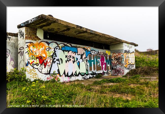Graffiti on shelter above Folkstone in Kent Framed Print by Clive Wells