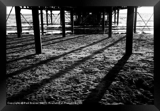 Under the Pier Framed Print by Paul Brewer