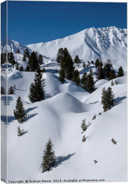 Undulating snowy mountainscape Canvas Print by Graham Moore