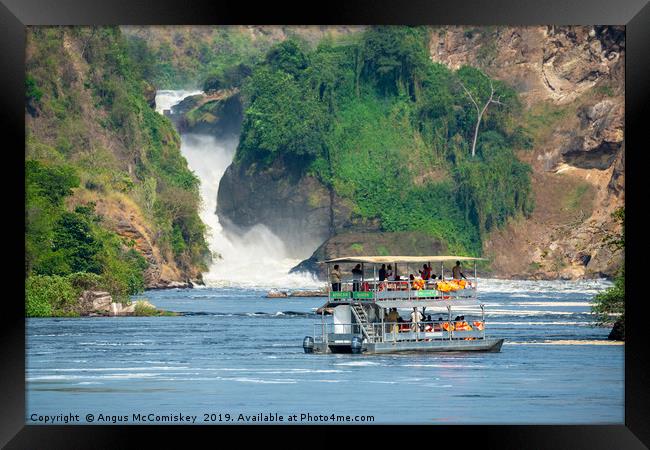 Tourist boat in front of Murchison Falls in Uganda Framed Print by Angus McComiskey