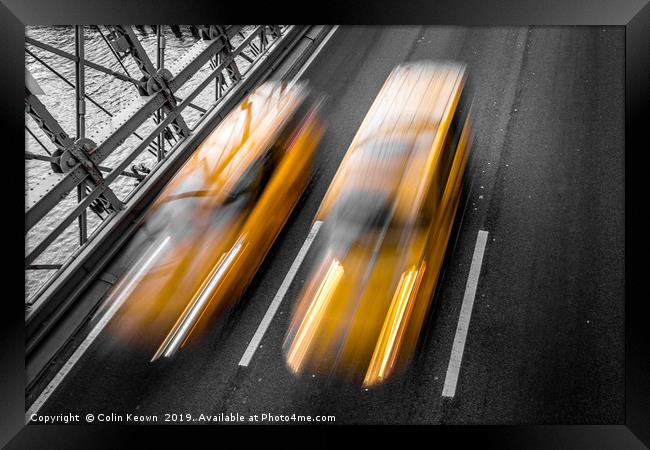 Yellow cabs crossing Brooklyn Bridge Framed Print by Colin Keown