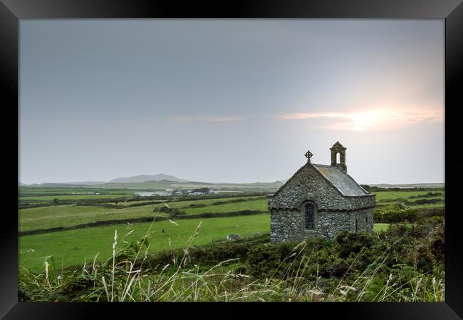 The isolated St Non's Chapel with the sun setting  Framed Print by David Wall