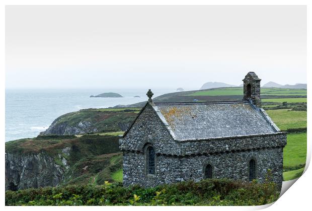 St Non's Chapel on the edge of a wild rugged coast Print by David Wall