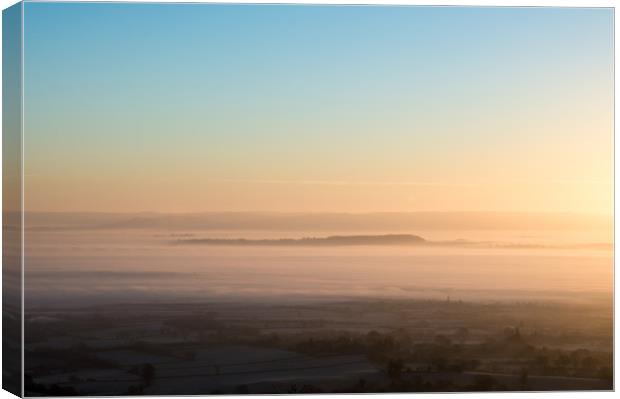 Mist covering the English countryside on a cold wi Canvas Print by David Wall