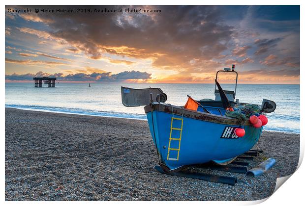 Dramatic sunrise sky over a fishing boat on the be Print by Helen Hotson