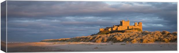 Bamburgh Castle as the Sun goes down Canvas Print by Naylor's Photography