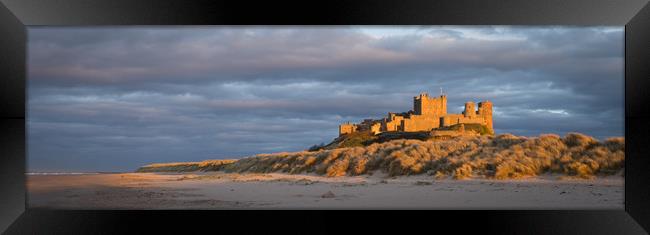 Bamburgh Castle as the Sun goes down Framed Print by Naylor's Photography
