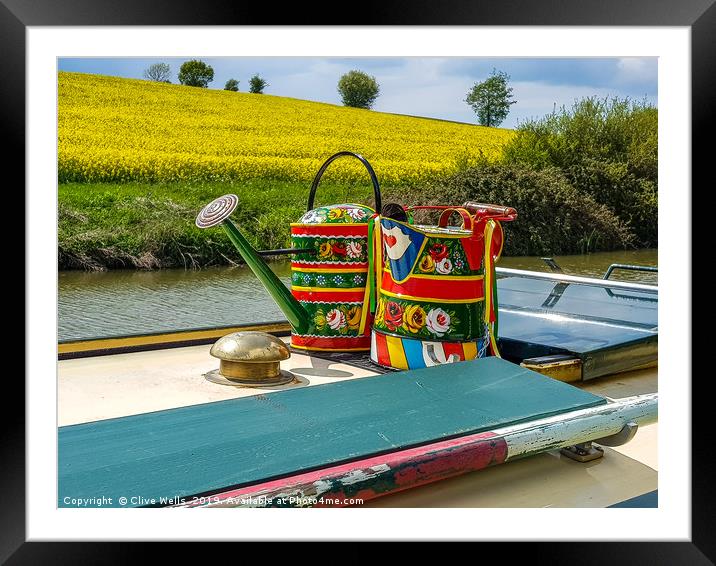 Watering cans on a narrow boat. Framed Mounted Print by Clive Wells