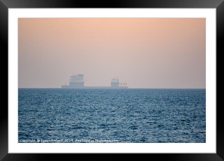 Boskalis ship in the horizon of a sunset Framed Mounted Print by Susan Ireland
