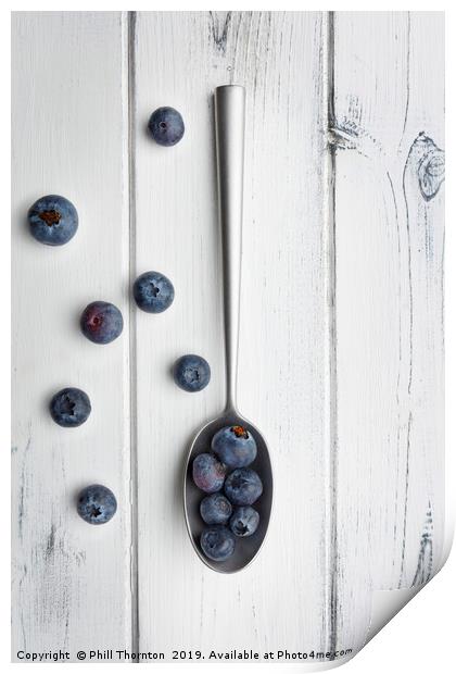 blueberries and a silver spoon on distressed white Print by Phill Thornton