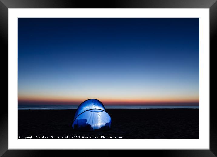 Illuminated tent on the beach by the sea Framed Mounted Print by Łukasz Szczepański