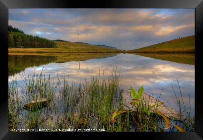 Wind Turbine and Lake Reflections Framed Print by Neil Holman