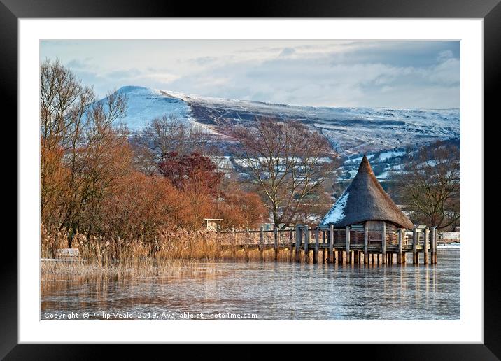 Llangorse Lake Crannog and Mynydd Troed in Winter. Framed Mounted Print by Philip Veale