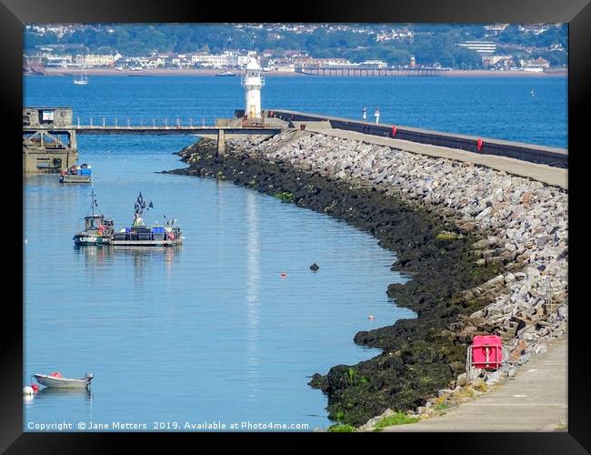 Breakwater and Lighthouse Brixham Framed Print by Jane Metters