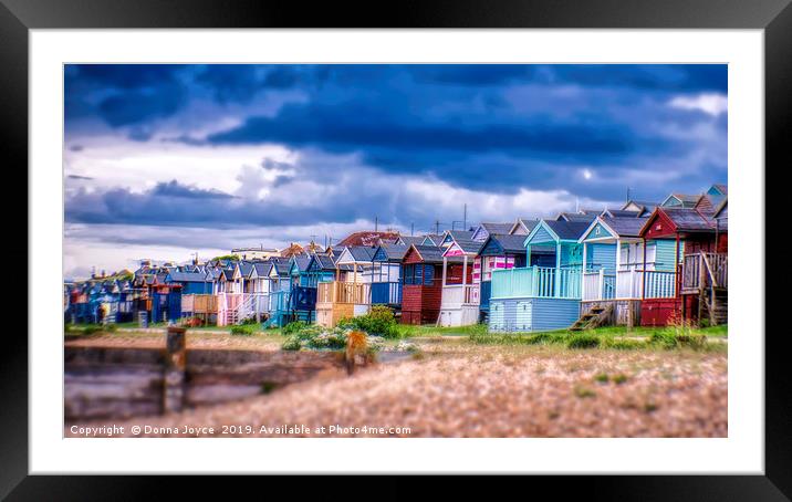 Beach huts at Tankerton slopes near Whitstable Framed Mounted Print by Donna Joyce