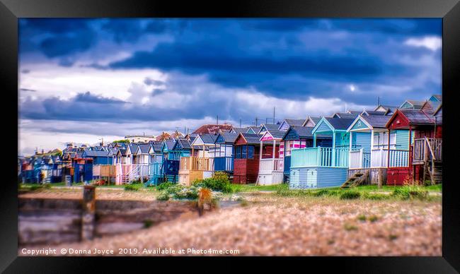 Beach huts at Tankerton slopes near Whitstable Framed Print by Donna Joyce