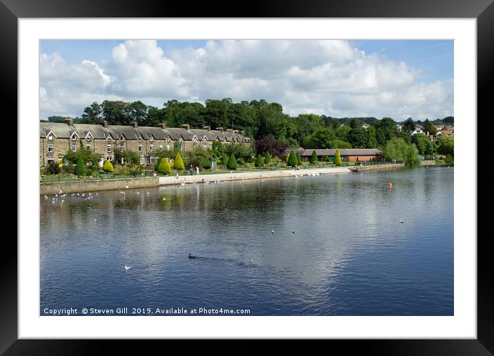 Cottages and Gardens Along a River Bank. Framed Mounted Print by Steven Gill