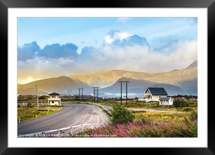 Road with mountains and wooden houses, Leknes. Framed Mounted Print by RUBEN RAMOS