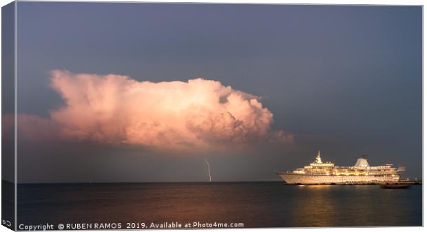 A thunderbolt hit the sea next to a ship. Canvas Print by RUBEN RAMOS