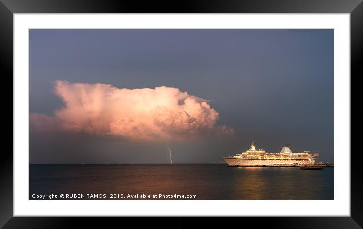 A thunderbolt hit the sea next to a ship. Framed Mounted Print by RUBEN RAMOS