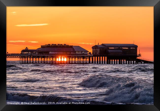 Cromer Pier Sunset Framed Print by Neal Trafankowski